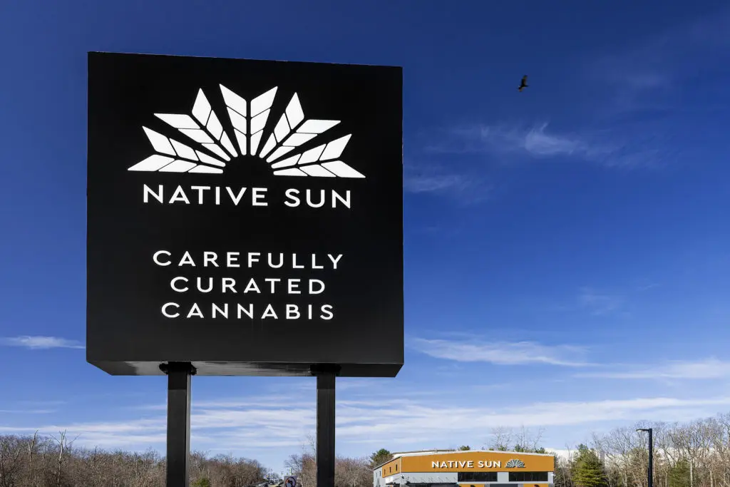 Large black road sign with the Native Sun logo in white on it.