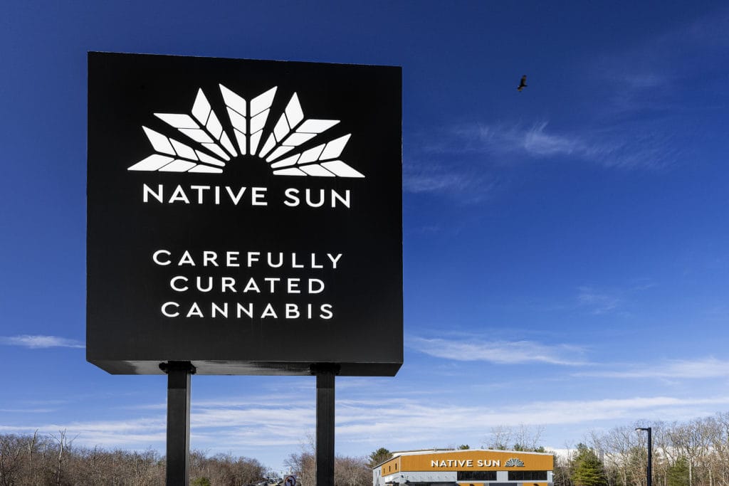 Large black road sign with the Native Sun logo in white on it.